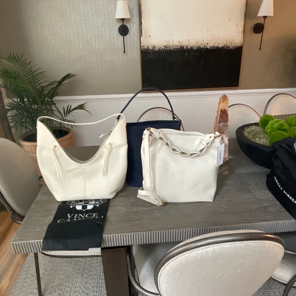 Three leather bags, cream, and navy blue, large